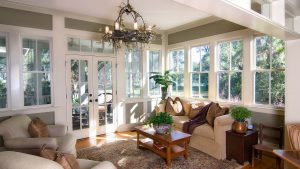 Large sunroom with vinyl windows and French doors